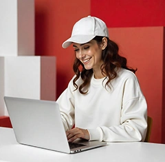 Web designer working on a laptop creating responsive web design in Perth